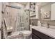 Bathroom with marble walk-in shower, modern sink and ample storage at 8133 Arapahoe Peak St, Littleton, CO 80125