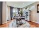 Cozy breakfast nook with natural light, modern furnishings, and wood flooring at 8133 Arapahoe Peak St, Littleton, CO 80125