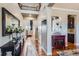 Elegant foyer with hardwood floors, a large mirror, and a staircase leading to the upper level at 8133 Arapahoe Peak St, Littleton, CO 80125