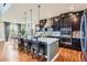 Spacious kitchen with seating around the large island and seamlessly integrates with the breakfast area at 8133 Arapahoe Peak St, Littleton, CO 80125
