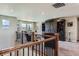 Cozy loft space featuring a large dark wood entertainment center and comfortable seating area with scenic views at 8133 Arapahoe Peak St, Littleton, CO 80125