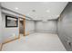 Basement area with neutral carpet, small window, and concrete walls at 1876 S Adams St, Denver, CO 80210