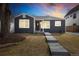 Charming home featuring a well-maintained yard and walkway leading to the front door at 1876 S Adams St, Denver, CO 80210