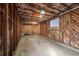 A partially finished detached garage with exposed beams and a single window at 1876 S Adams St, Denver, CO 80210
