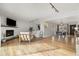 Open living room with hardwood floors and view to dining room at 1876 S Adams St, Denver, CO 80210