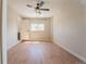 Bedroom featuring light walls, wood flooring, and a window for natural light at 6935 W 16Th Ave, Lakewood, CO 80214