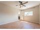 Bedroom featuring neutral walls, wood floors, ceiling fan, and closet with a white door at 6935 W 16Th Ave, Lakewood, CO 80214