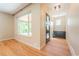 Inviting entryway features hardwood floors, a stylish front door, and a large window that floods the space with natural light at 6935 W 16Th Ave, Lakewood, CO 80214