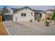 A home with a gravel driveway and low shrubbery next to the side of the house at 6935 W 16Th Ave, Lakewood, CO 80214
