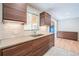 Modern kitchen featuring stainless steel appliances, sleek cabinets, and ample counter space at 6935 W 16Th Ave, Lakewood, CO 80214