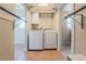Convenient laundry area includes modern washer and dryer appliances, plus access to an adjacent bathroom at 6935 W 16Th Ave, Lakewood, CO 80214