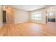 Bright living room with hardwood floors and large window, offering ample natural light and neutral walls at 6935 W 16Th Ave, Lakewood, CO 80214