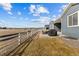 Backyard view of house and fenced in yard at 5035 Old Ranch Dr, Longmont, CO 80503