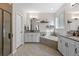 Bright bathroom with a soaking tub, double vanity, and stand alone shower at 5035 Old Ranch Dr, Longmont, CO 80503