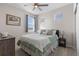 Cozy bedroom featuring neutral walls, carpet floors, ceiling fan and a comfortable bed with plush pillows and bedding at 5035 Old Ranch Dr, Longmont, CO 80503