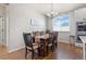 Cozy dining room with hardwood floors, decorative lighting, and lots of natural light at 5035 Old Ranch Dr, Longmont, CO 80503