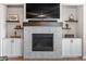 Close up of the living room fireplace with built-ins and a TV above at 5035 Old Ranch Dr, Longmont, CO 80503