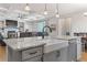 Kitchen island and view of the living area in this modern home at 5035 Old Ranch Dr, Longmont, CO 80503