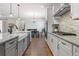 Stylish kitchen with white cabinets, granite countertops, and stainless steel appliances at 5035 Old Ranch Dr, Longmont, CO 80503