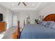 Relaxing main bedroom showcasing a king-size bed and dual closets at 5035 Old Ranch Dr, Longmont, CO 80503