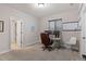 Functional home office with a modern desk setup, including dual monitors, comfortable chair, and ample natural light at 5035 Old Ranch Dr, Longmont, CO 80503