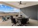 Covered patio with table and chairs and view of open field and distant mountains at 5035 Old Ranch Dr, Longmont, CO 80503