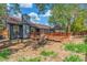 A backyard with a wooden deck and firepit, perfect for outdoor entertainment at 2026 S Pitkin St, Aurora, CO 80013