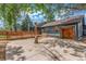 Backyard featuring patio, wooden fence, and mature trees at 2026 S Pitkin St, Aurora, CO 80013