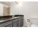Bathroom featuring vanity, toilet, and shower at 2026 S Pitkin St, Aurora, CO 80013