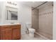 Bathroom featuring a tiled shower, vanity, and toilet at 2026 S Pitkin St, Aurora, CO 80013