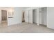 A bedroom with neutral carpet, a closet, and a view into the bathroom at 2026 S Pitkin St, Aurora, CO 80013