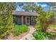 Charming home featuring a cozy entryway with lush landscaping and a concrete walkway at 2026 S Pitkin St, Aurora, CO 80013