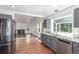 A kitchen featuring granite countertops, gray cabinets, stainless appliances, and hardwood floors at 2026 S Pitkin St, Aurora, CO 80013