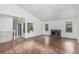 Bright living room with hardwood floors, a fireplace, and sliding glass doors to the backyard at 2026 S Pitkin St, Aurora, CO 80013