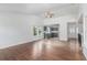 Bright open living area with hardwood floors flowing into a modern kitchen at 2026 S Pitkin St, Aurora, CO 80013
