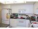 Functional kitchen with white appliances and ample storage at 13890 E Marina Dr # 605, Aurora, CO 80014