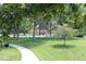 Serene view of the pool area, surrounded by lush greenery and trees at 13890 E Marina Dr # 605, Aurora, CO 80014