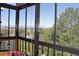 Bright sunroom with large windows showcasing a green landscape and mountain views at 13890 E Marina Dr # 605, Aurora, CO 80014