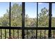A view of the green landscape through the large windows of the sunroom at 13890 E Marina Dr # 605, Aurora, CO 80014