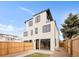 Modern home with a backyard with wooden privacy fence at 2391 King St, Denver, CO 80211
