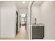 Hallway featuring a sink and leading to a well-decorated bedroom at 2391 King St, Denver, CO 80211