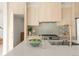 Modern kitchen showcasing bright countertops, stainless steel appliances, and light wood cabinets at 2391 King St, Denver, CO 80211
