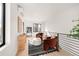 Relaxing upstairs sitting area with natural light, modern furnishings, and views at 2391 King St, Denver, CO 80211