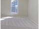 Bright bedroom with plush carpet, large window, and natural light at 6776 S Holland Way, Littleton, CO 80128