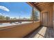 Private balcony offers outdoor living space and scenic views of the parking area at 4691 S Decatur St # 215, Englewood, CO 80110