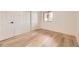 Clean bedroom with new floors, closet, and a sunny window at 4691 S Decatur St # 215, Englewood, CO 80110