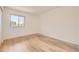 Bright bedroom with large window and modern flooring at 4691 S Decatur St # 215, Englewood, CO 80110