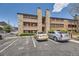 Exterior of building featuring wood and stone with ample parking available for tenants at 4691 S Decatur St # 215, Englewood, CO 80110