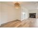 Bright living room features a cozy fireplace and sleek, modern flooring at 4691 S Decatur St # 215, Englewood, CO 80110