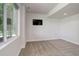 Bright basement with a window, television, and neutral carpet at 5528 Echo Hollow St, Castle Rock, CO 80104